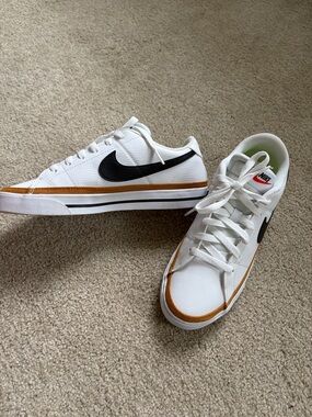Nike Women’s White Sneakers with Black Swoosh and Gold Accent NWOT